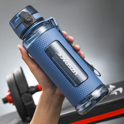 Portable Leak-Proof Sports Bottle – Made from Tritan plastic, durable, and anti-fall design, ideal for fitness and gym use.